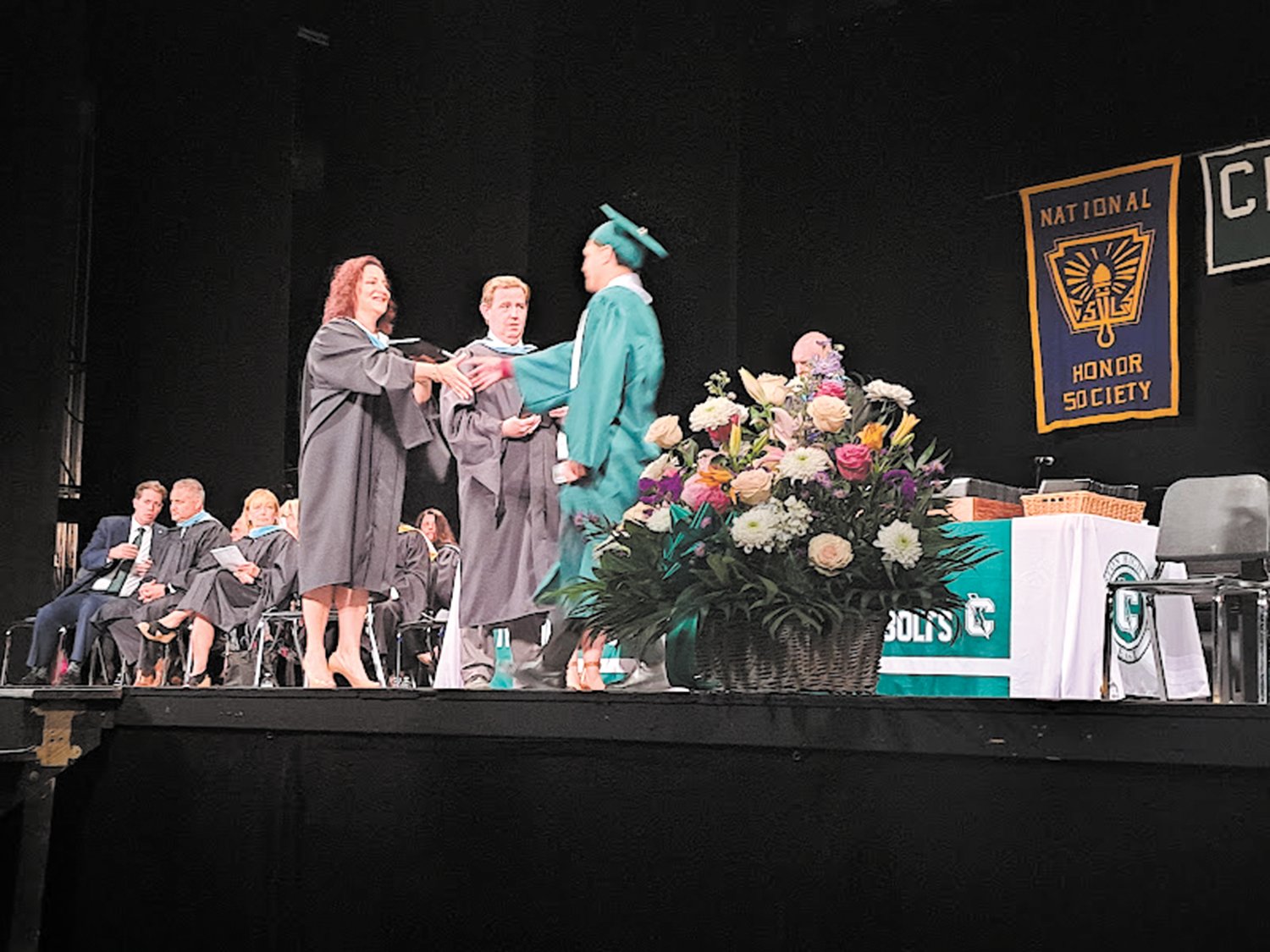 CONGRATULATIONS TO YOU: (above) Superintendent Jeannine Nota-Masse congratulates a student from the Class of 2022 as they receive their diploma.